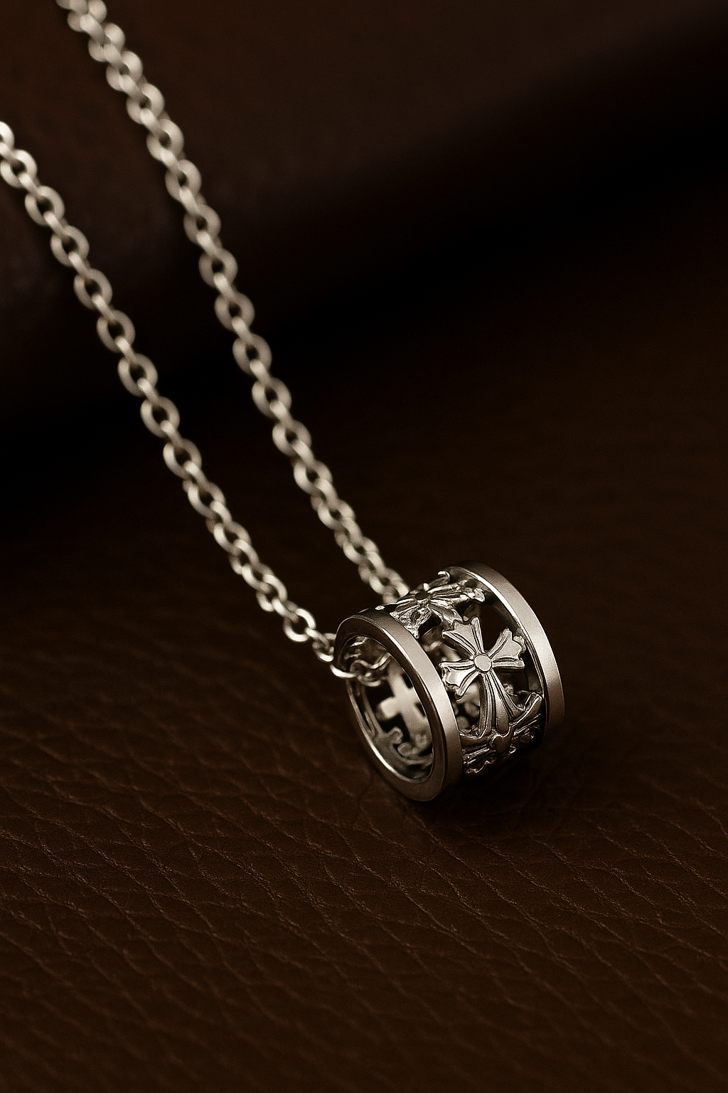FLOs Eternal Axis – Rotating Cross Barrel Pendant